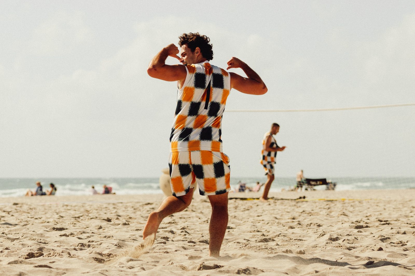 CFPM player celebrating on the beach